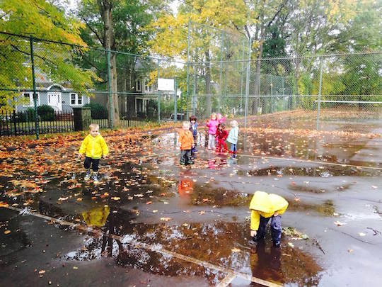 Preschool playing in the rain